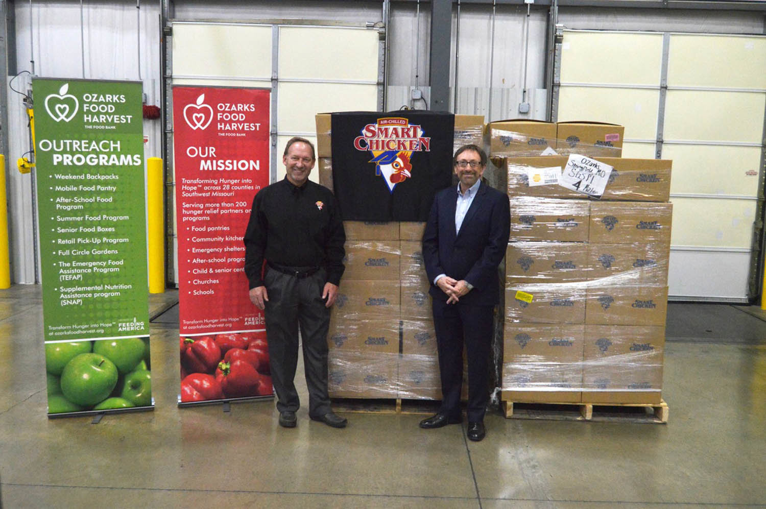 SMART GIVING
Nebraska-based Smart Chicken donated 7,000 pounds of chicken Dec. 18, 2019, to Ozarks Food Harvest Inc. as part of the company’s 17th annual Smart Giving Holiday Challenge campaign. Pictured are Joe Horvath, account manager for Smart Chicken, left, and Bart Brown, president and CEO of Ozarks Food Harvest. During the challenge in November, Smart Chicken donates 10% of poultry purchased at area retailers, including Harter House, Price Cutter, Country Mart and Food 4 Less.